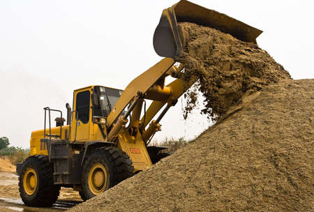 A wheel loader's working in a construction area.