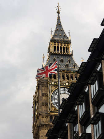 Bigben and british flag in a cloudy day の写真素材