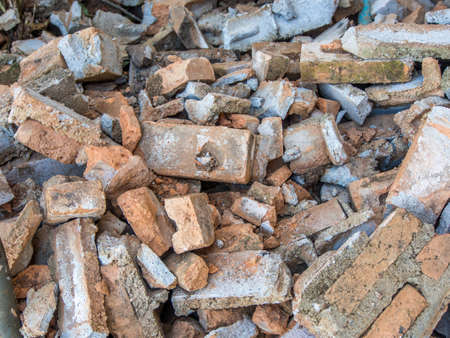 Broken bricks on the ground in factory 