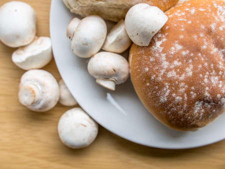 a group of Buttom mushroom on wooden board の写真素材