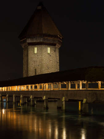 Chapel Bridge at night with reflection on the water の写真素材