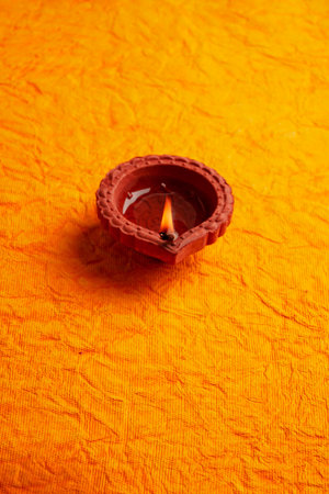 Happy Diwali - Diya lamps lit during diwali celebrationの写真素材