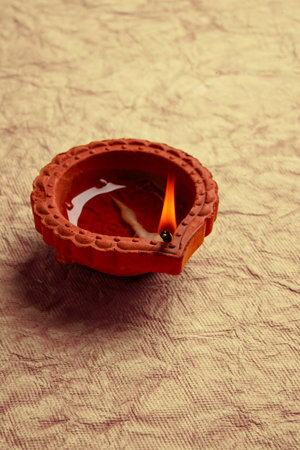 Happy Diwali - Diya lamps lit during diwali celebrationの写真素材