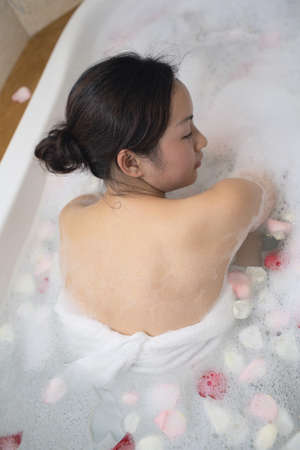 beautiful women doing spa in bathroomの写真素材
