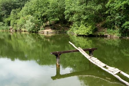 low-quality platform for swimming on the shore of Forest Lakeの写真素材