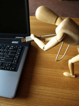 wooden doll is cheap and loyal office helperの写真素材