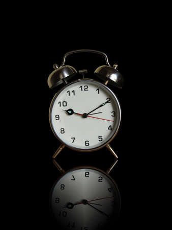 ringing clock on black