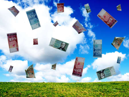 fall of different banknotes on the sky backgroundの写真素材