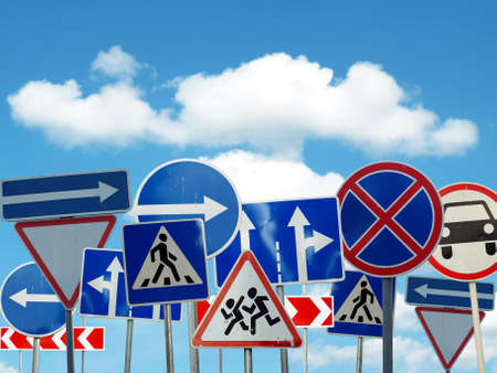 many caution signs of the road on sky backgroundの写真素材