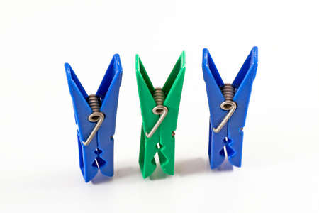 three cloth pegs isolated on white backgroundの写真素材