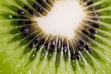 close up slice of juicy kiwi fruitの写真素材