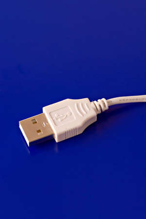  USB connection cable isolated on blue backgroundの写真素材
