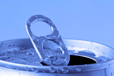  opened can of cold drink on blue backgroundの写真素材