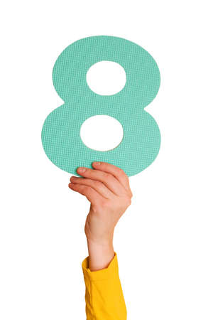 number eight  in hand,isolated on white backgroundの写真素材