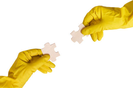 partnership concept. two hands with different pieces of puzzle