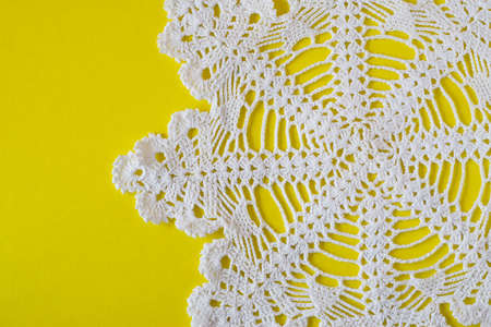 homemade white decorative  napkin on yellow background