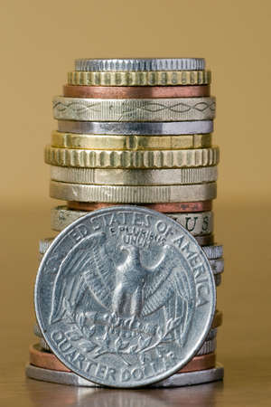  coins stack with quarter dollar in a front