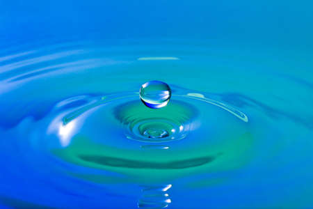  Environmental abstract background. Blue droplet splashing in clear clean waterの写真素材