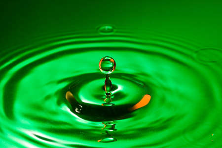  tranquility conceptual. perfect droplet splash in a waterの写真素材
