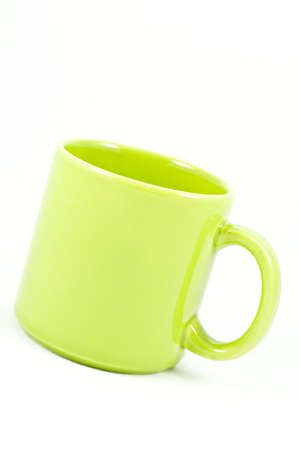 green ceramic cup isolated on white backgroundの写真素材