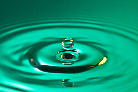  tranquility conceptual. calm droplet splash in a waterの写真素材