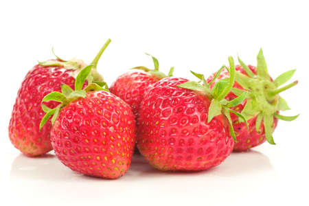 five red strawberries, isolated on white backgroundの写真素材