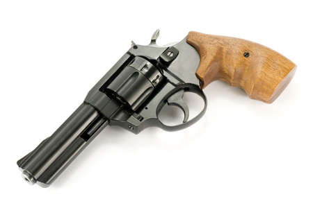 revolver gun with wooden handle , over white backgroundの写真素材