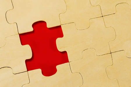  wooden puzzle background with one piece missing