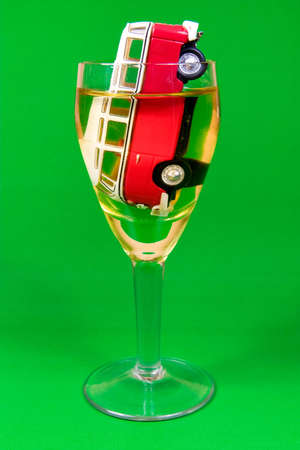 drunk driving concept. car in a glass on green backgroundの写真素材