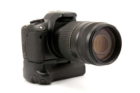 camera with battery grip and lens. isolated on whiteの写真素材