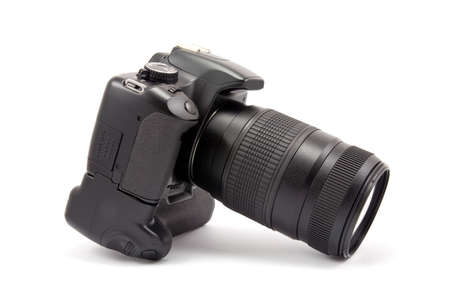 photo camera with battery grip and lens. isolated on whiteの写真素材