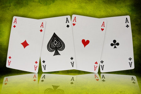 four aces with reflection on green background のeditorial素材