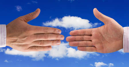 Handshake of businessmen. isolated on sky backgroundの写真素材
