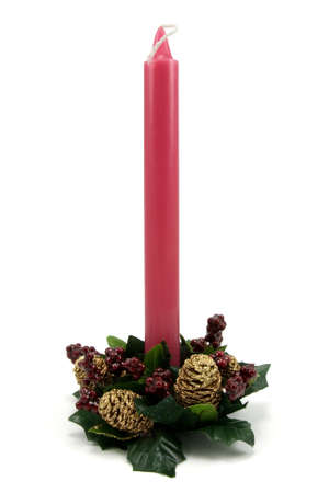 Traditional Christmas red candle  on white backgroundの写真素材