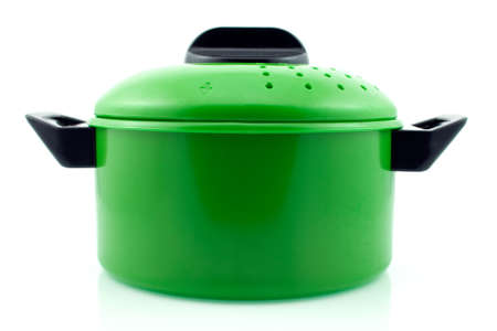 green cooking pot with reflection on whiteの写真素材