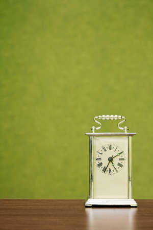 Old-fashioned clock shows the time ten past five の写真素材