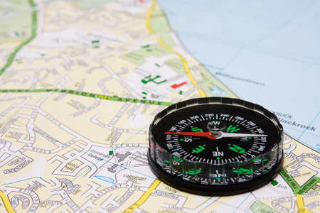 business travel concept. compass on city map background. の写真素材