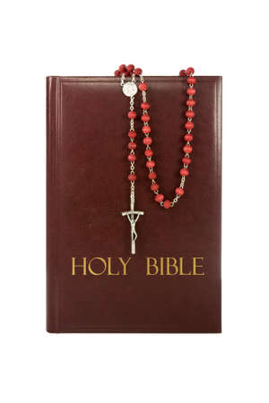 holy bible with rosary isolated on white background.
