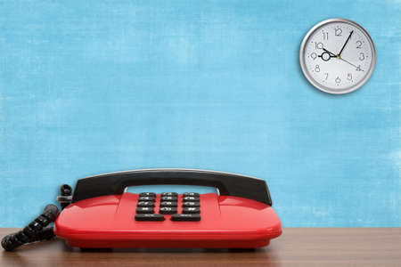  telephone  and wall clock in the office.の写真素材
