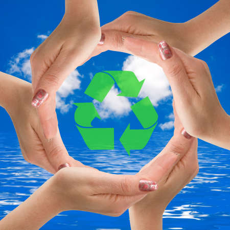 Hands making a circle  with recycle icon in the middle. の写真素材