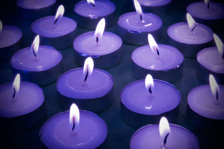 Close up view of the candles cutting through the darkness