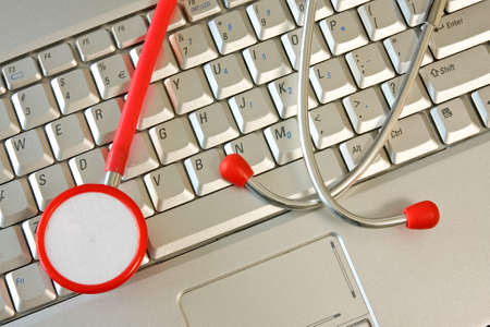 Concept for online medicine or IT support . Computer keyboard with a stethoscope.