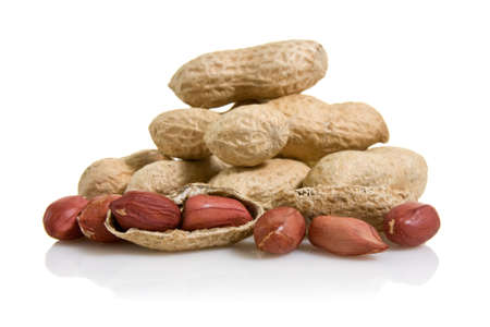 pile of peanuts with reflection on white background