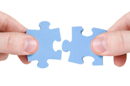 teamwork concept. two hands with different pieces of puzzle