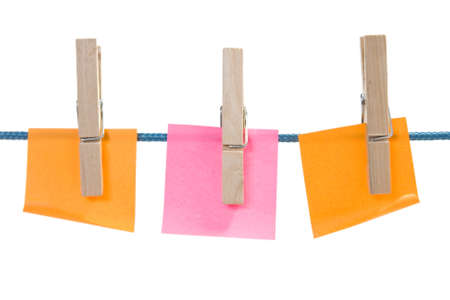 color paper sheets on rope. isolated over a white backgroundの写真素材