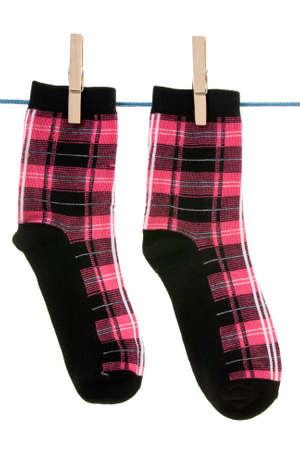 two socks hang on rope grafted with clothespin 