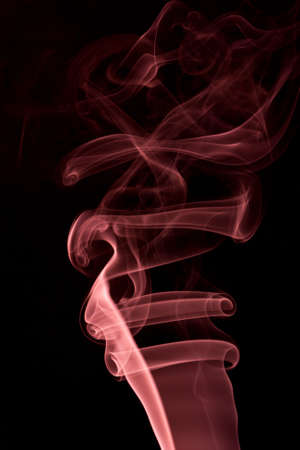 red abstract smoke on the black backgroundの写真素材