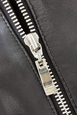 close-up of black leather jacket with metal zipper 