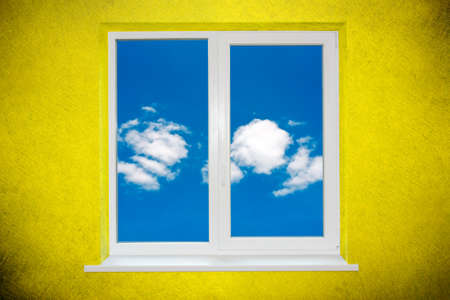 Sky in the window on green painted wallの写真素材