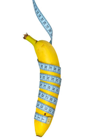 Banana hung on measure tape. Isolated over a white backgroundの写真素材